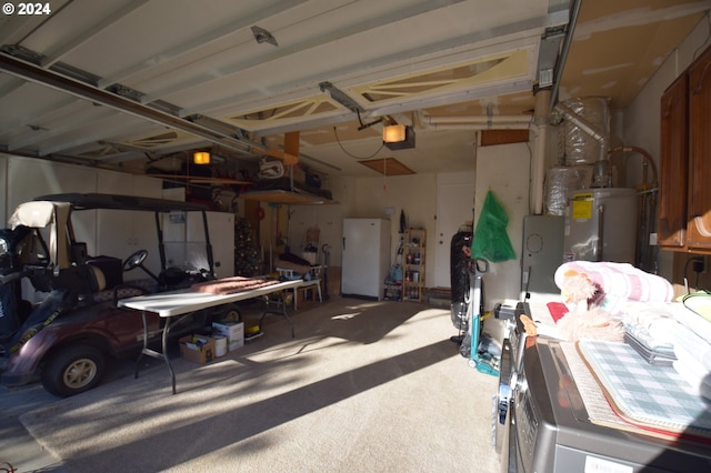 garage featuring gas water heater, a garage door opener, and white fridge