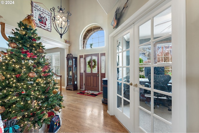 foyer entrance with french doors and light wood-type flooring