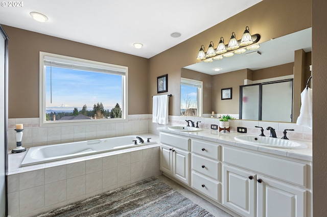 bathroom with plus walk in shower and vanity