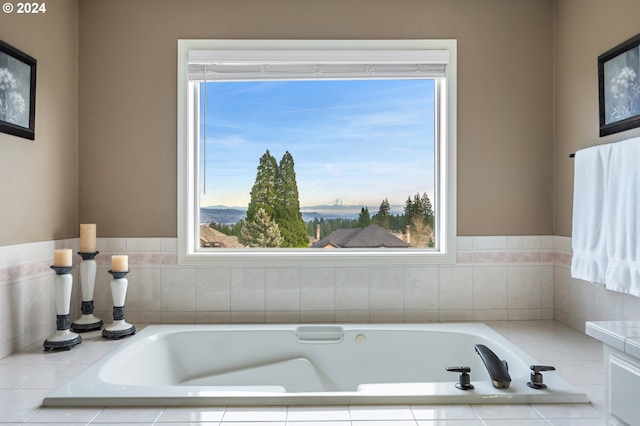 bathroom with a relaxing tiled tub