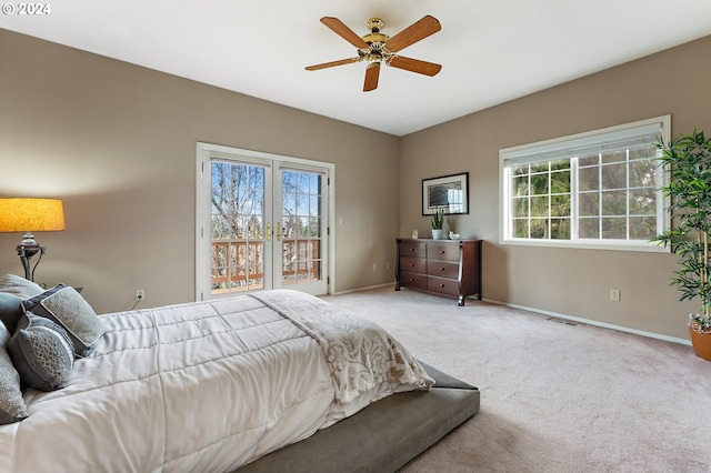 carpeted bedroom with ceiling fan and access to outside