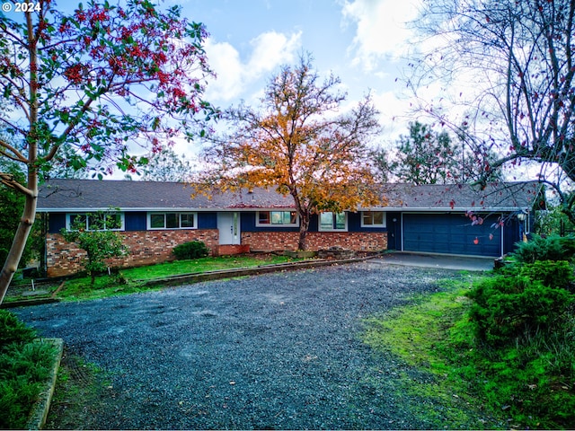 ranch-style house featuring a garage