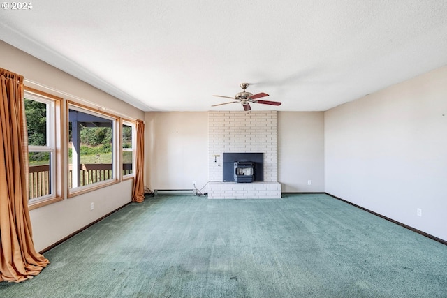 unfurnished living room featuring baseboard heating, ceiling fan, and carpet flooring