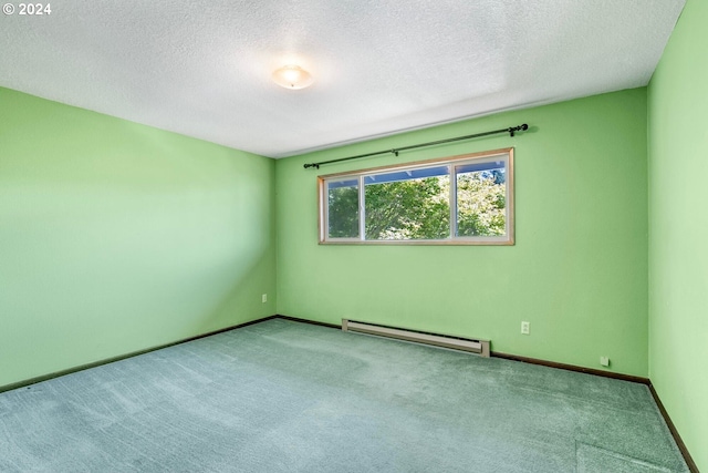 carpeted spare room featuring a textured ceiling and baseboard heating