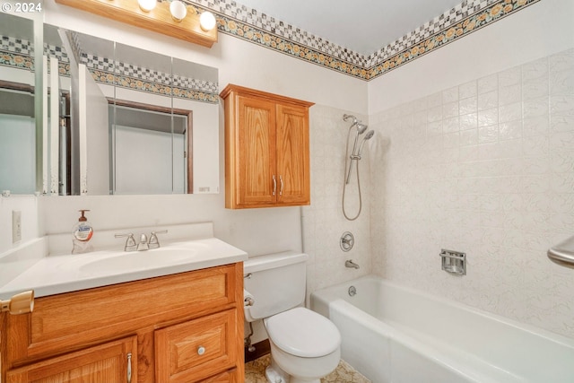 full bathroom featuring vanity, toilet, and tiled shower / bath combo