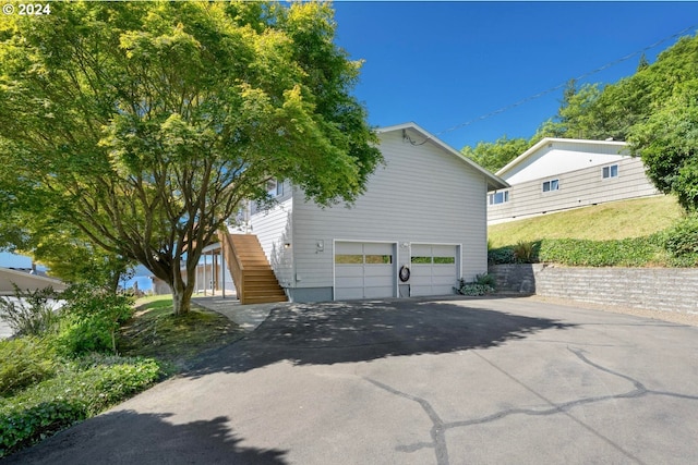 view of side of property with a garage