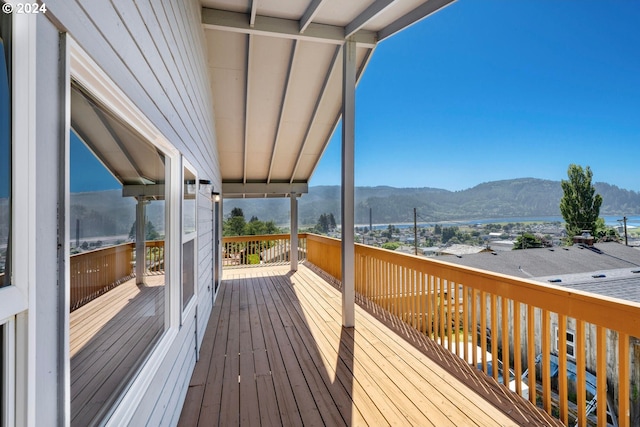 wooden terrace with a mountain view