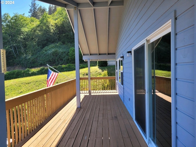 deck featuring a lawn