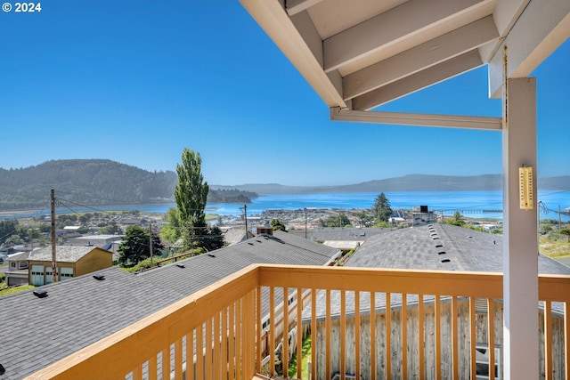 balcony with a water and mountain view