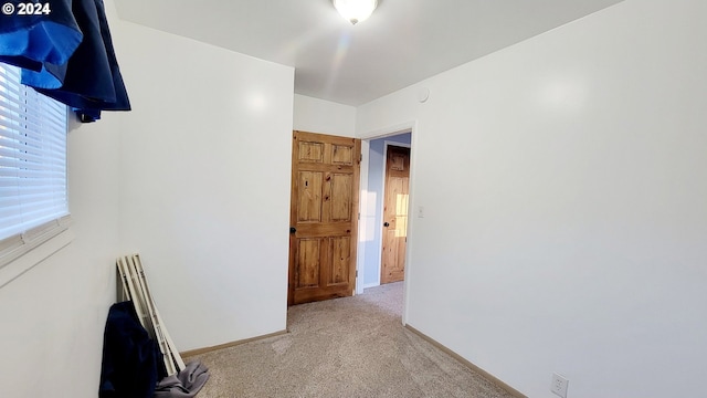 carpeted empty room featuring a healthy amount of sunlight