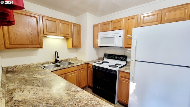 kitchen with white appliances and sink