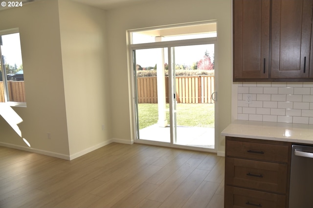 doorway featuring light hardwood / wood-style floors and plenty of natural light