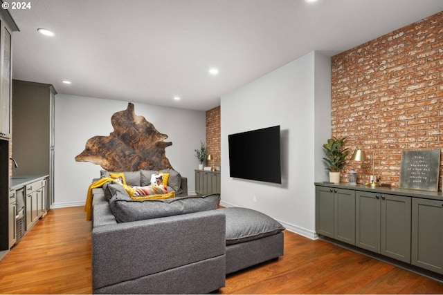 living room featuring recessed lighting, light wood-style flooring, and baseboards