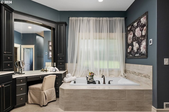 full bathroom with a bath, visible vents, tile patterned floors, and vanity