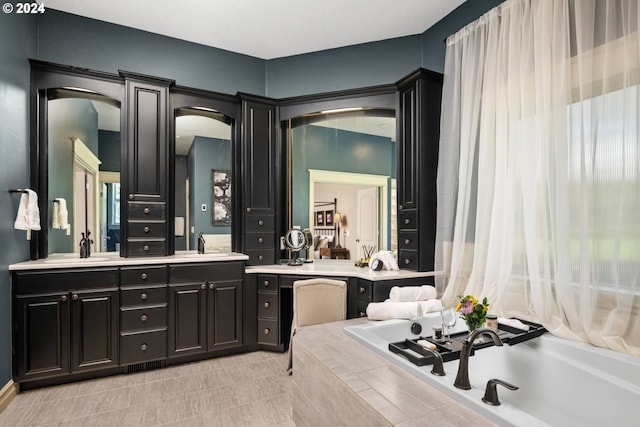 full bathroom featuring a sink, tiled tub, and double vanity