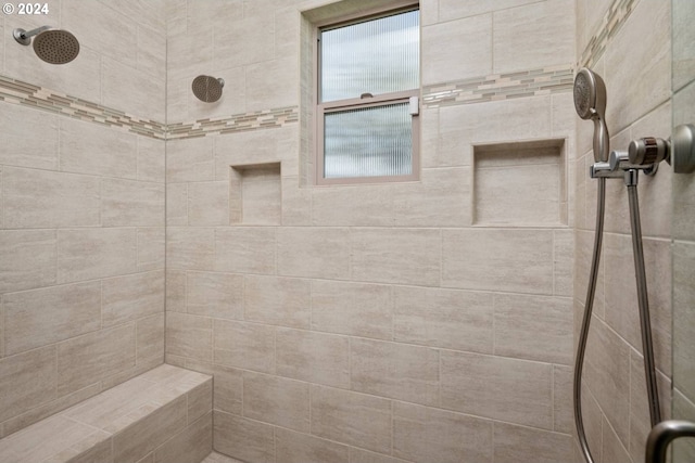 bathroom featuring a tile shower