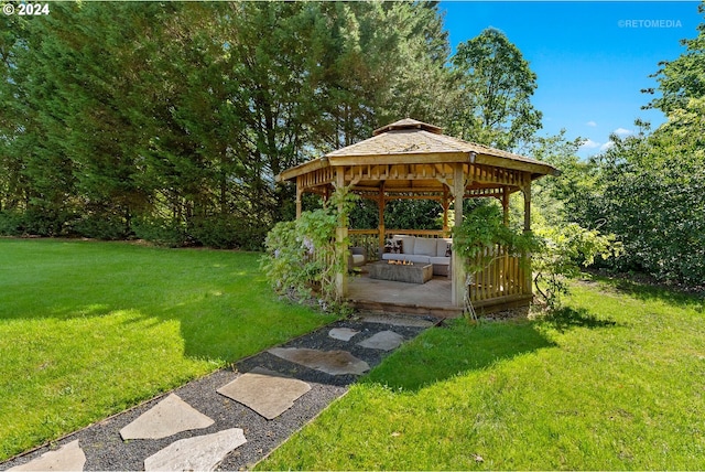 view of yard with a gazebo, an outdoor hangout area, and a patio