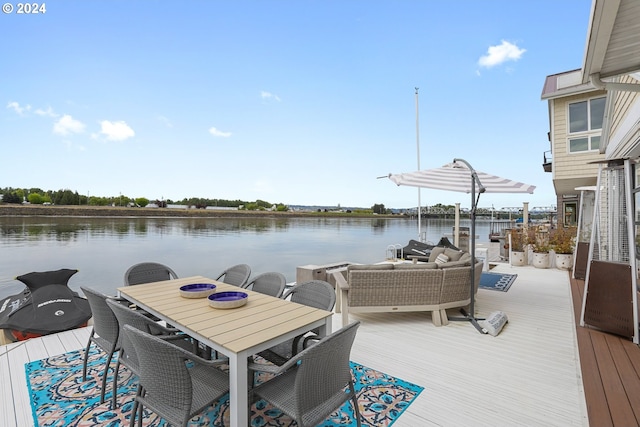 wooden deck featuring a water view