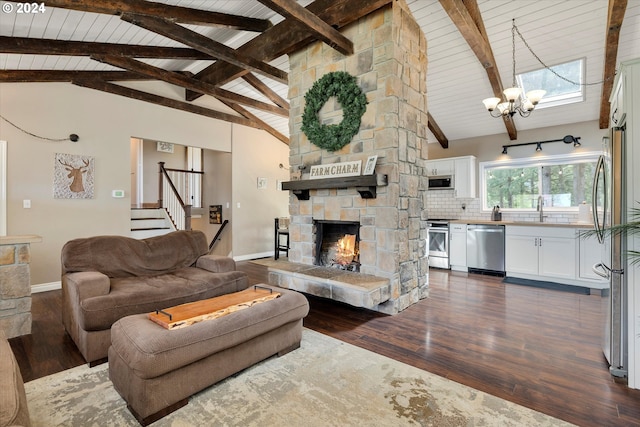 living room featuring high vaulted ceiling, dark hardwood / wood-style floors, an inviting chandelier, beam ceiling, and a stone fireplace