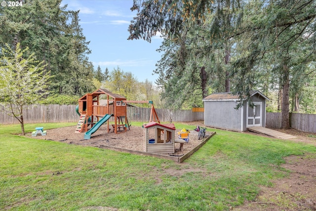 view of play area featuring a lawn and an outdoor structure