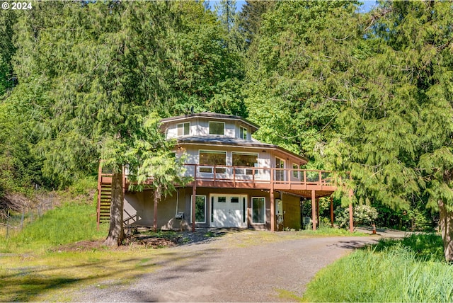 view of front facade featuring a wooden deck