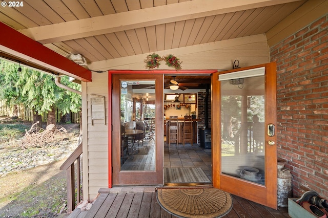 property entrance with a deck and french doors