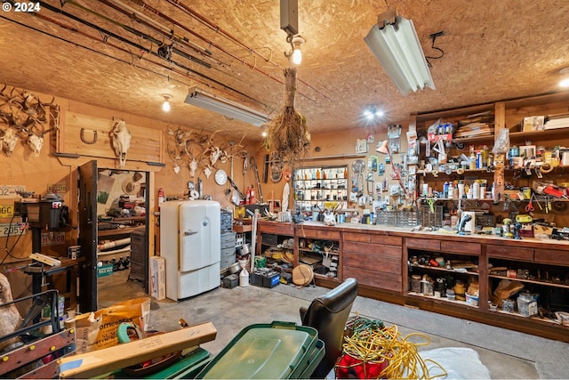 interior space with a workshop area and concrete flooring