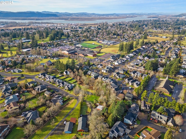 aerial view featuring a water and mountain view