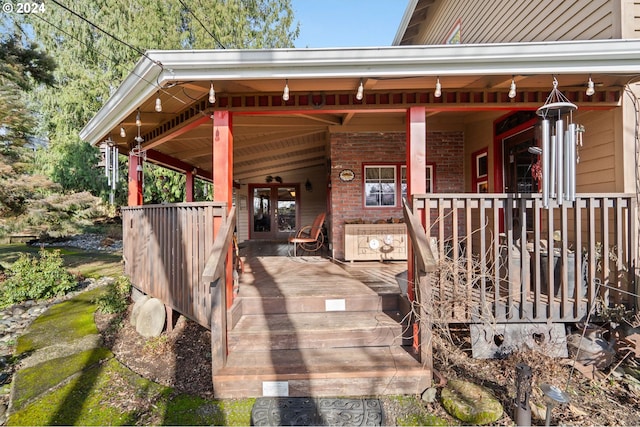 exterior space featuring a wooden deck and french doors