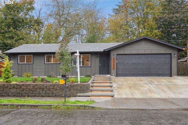 ranch-style house featuring a garage