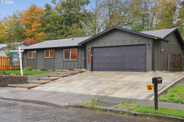 ranch-style home featuring a garage