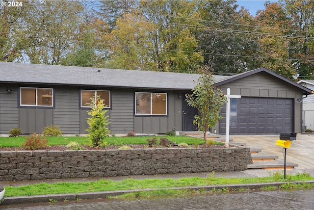 ranch-style home with a garage