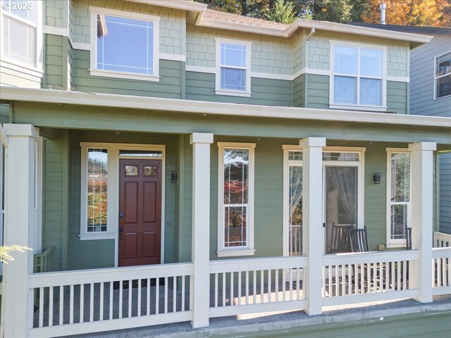 property entrance with covered porch