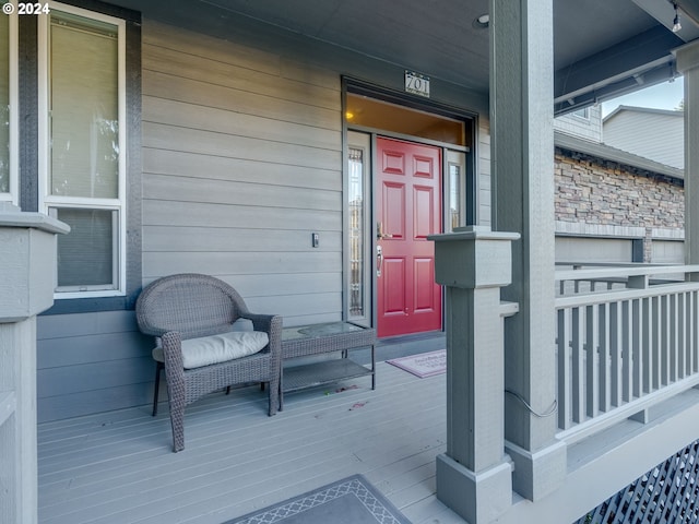 view of exterior entry with covered porch