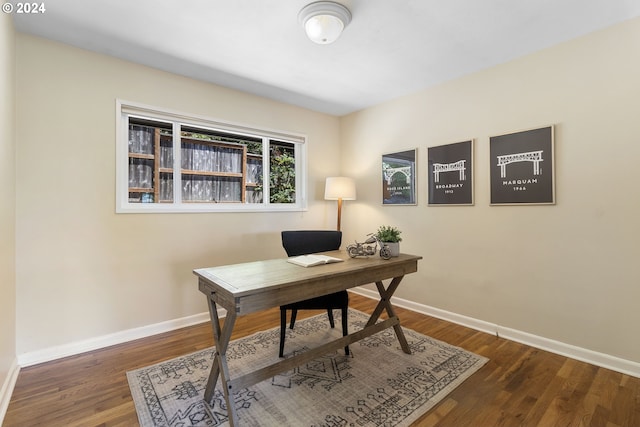 office space with dark wood-type flooring