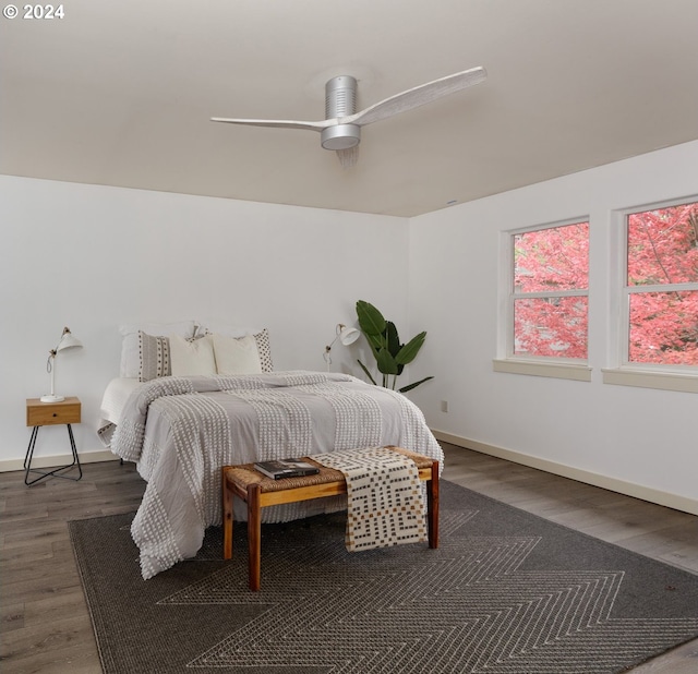 bedroom featuring dark hardwood / wood-style flooring and ceiling fan