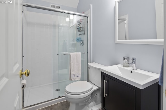 bathroom featuring walk in shower, toilet, vanity, and hardwood / wood-style flooring