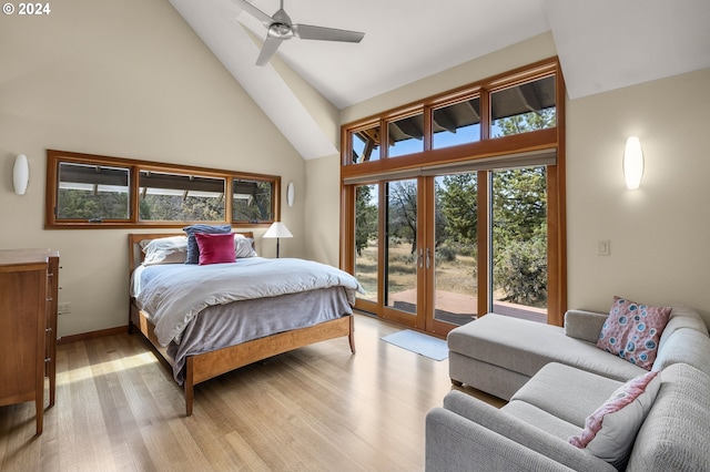 bedroom featuring ceiling fan, french doors, high vaulted ceiling, light hardwood / wood-style floors, and access to outside