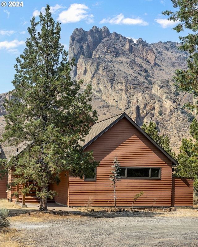 view of home's exterior with a mountain view