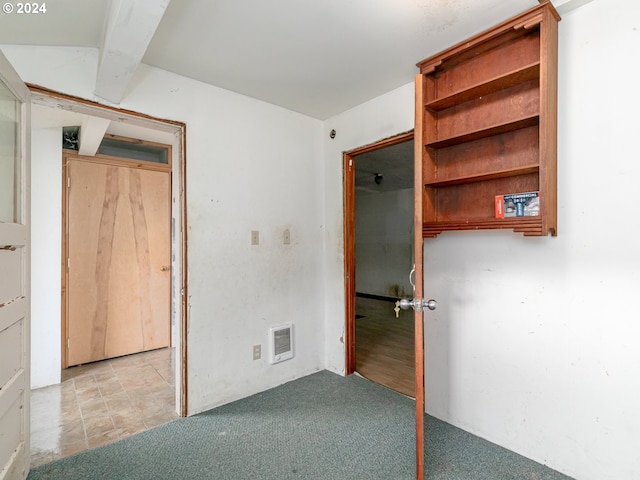 unfurnished bedroom featuring visible vents and light colored carpet