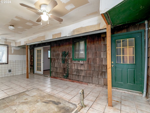 exterior space with a patio area and a ceiling fan