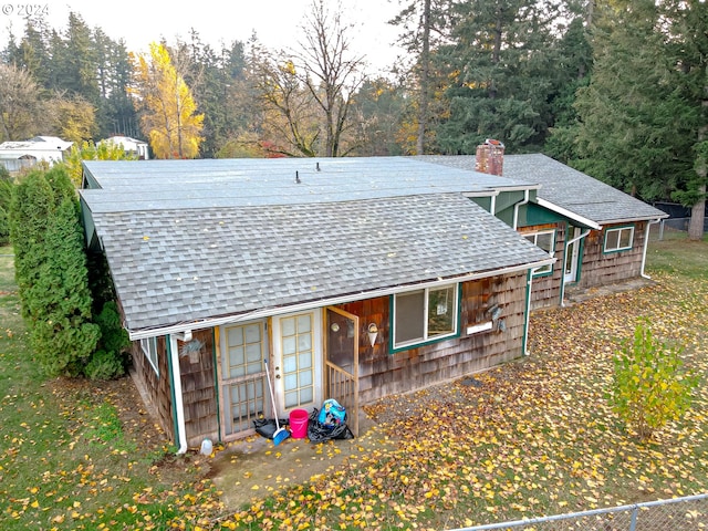 exterior space with a wooded view