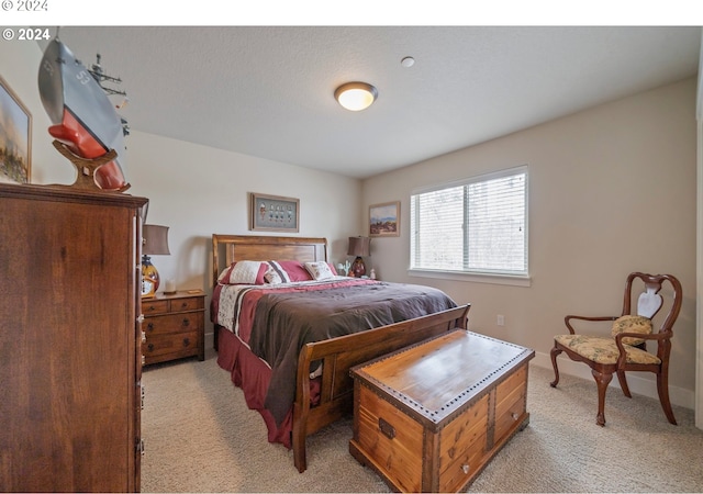 bedroom with light carpet