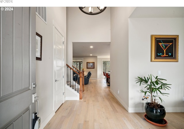 entryway featuring a notable chandelier and light hardwood / wood-style floors