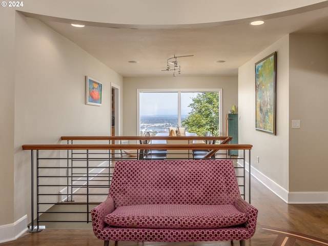 staircase with hardwood / wood-style floors