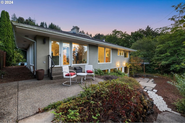 view of front of home with a patio area