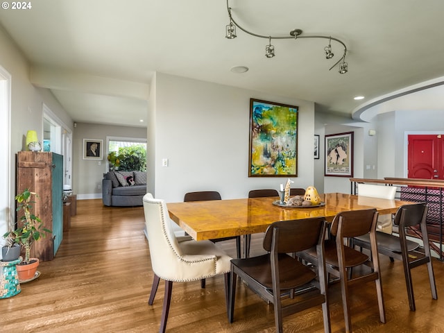 dining area with hardwood / wood-style floors