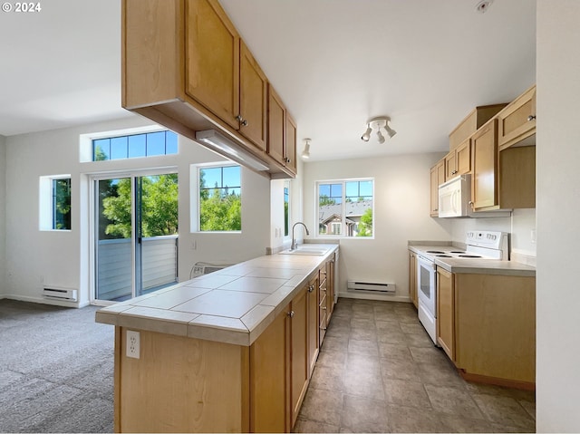 kitchen with tile countertops, a baseboard radiator, white appliances, and light tile floors