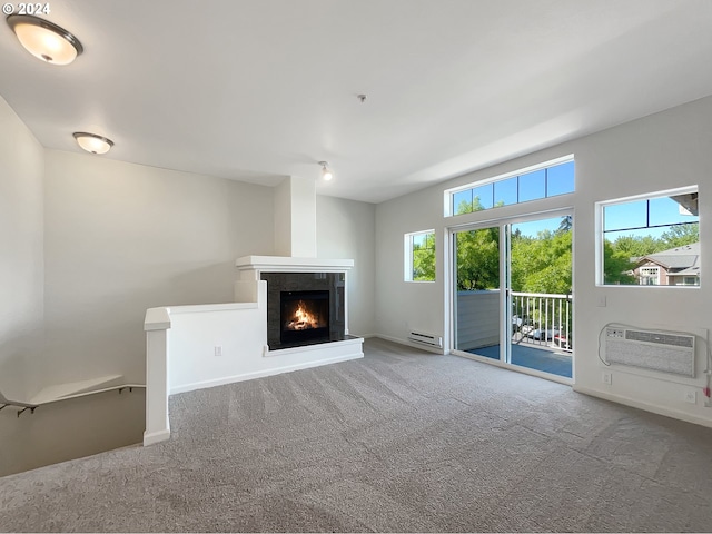 unfurnished living room with carpet, baseboard heating, and a wall mounted air conditioner