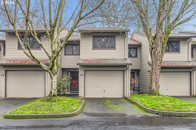 multi unit property featuring a garage